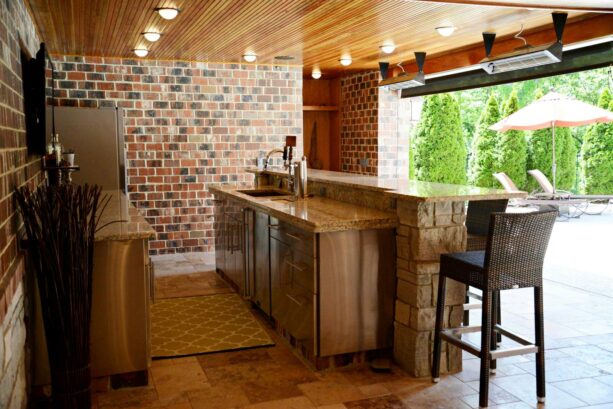 classic semi-outdoor galley kitchen with a multileveled top for a breakfast bar
