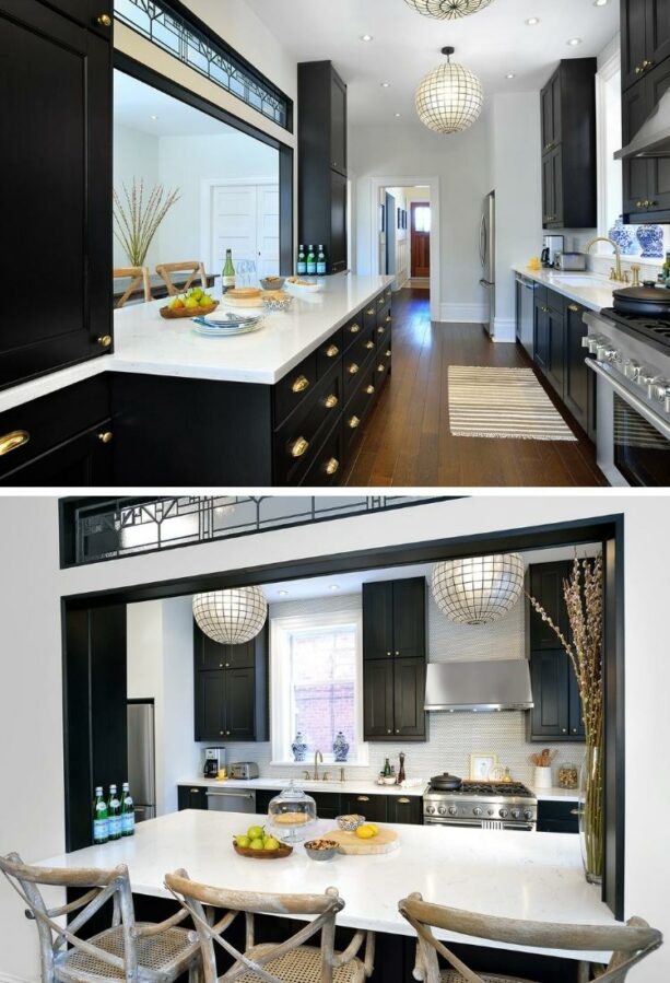 dark galley kitchen with a wide island as a breakfast bar