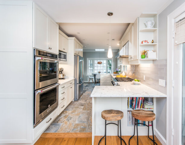 galley kitchen with two peninsulas on both sides to create a breakfast bar