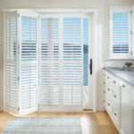 hunter douglas shutters for both kitchen door and windows