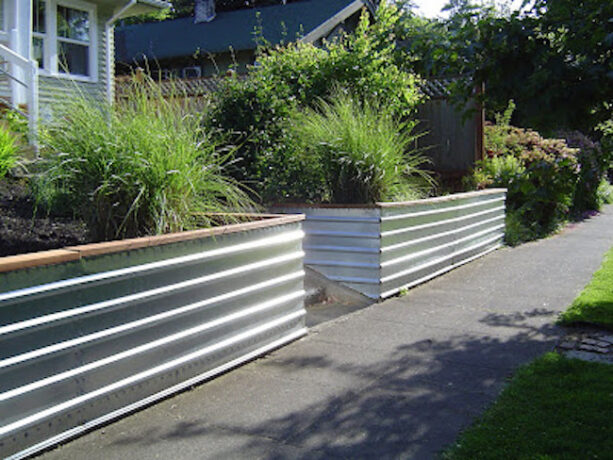 minimalist corrugated metal retaining wall with a wood top