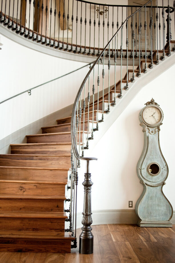 ornamented half wall stair railing to complement a traditional staircase