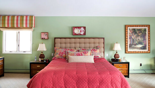 tea green wall to contrast the patterned pink duvet and pillows in the bedroom