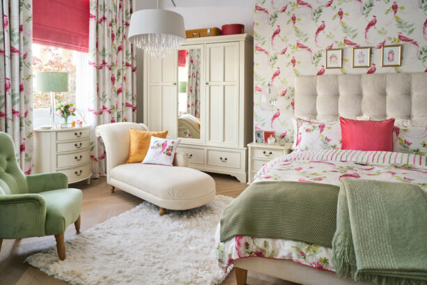 traditional bedroom with matching fabric and wallpaper in a pink and green color scheme