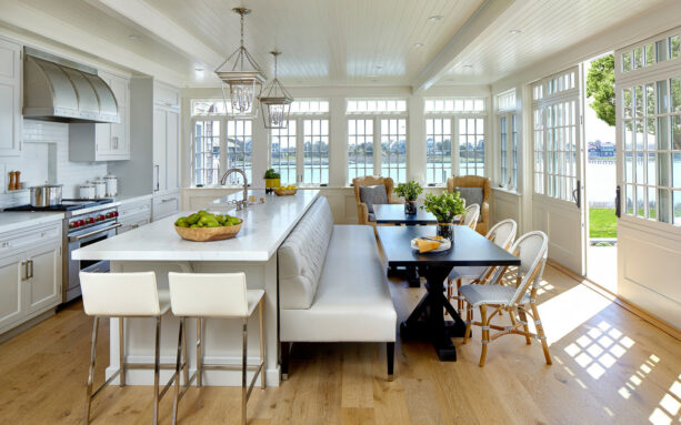 transitional and spacious open galley kitchen with a small breakfast bar
